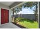 Well-maintained backyard with lush lawn, a door to a building, and shade trees for outdoor enjoyment at 10914 Savannah Wood Dr # 139, Orlando, FL 32832