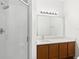 Modern bathroom features a walk-in shower, vanity with solid surface countertop, and updated fixtures at 10914 Savannah Wood Dr # 139, Orlando, FL 32832