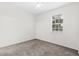 Comfortable bedroom featuring plush carpeting, a ceiling fan, and a bright window for natural light at 10914 Savannah Wood Dr # 139, Orlando, FL 32832
