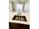 Kitchen sink with stainless steel faucet, double basin, and view of sliding glass doors at 10914 Savannah Wood Dr # 139, Orlando, FL 32832