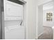 Convenient laundry area with stacked washer and dryer near bedrooms and other living spaces at 10914 Savannah Wood Dr # 139, Orlando, FL 32832