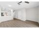 Open-concept living space with wood-look flooring, neutral walls, and seamless flow to the kitchen and dining areas at 10914 Savannah Wood Dr # 139, Orlando, FL 32832