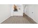 Bright and airy living area with wood-look floors, neutral paint, and open layout to the kitchen and dining area at 10914 Savannah Wood Dr # 139, Orlando, FL 32832