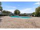 Community pool surrounded by lounge chairs, palm trees, and a brick patio at 10914 Savannah Wood Dr # 139, Orlando, FL 32832