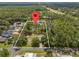 Expansive lot with mature trees and a pond, offering privacy and natural beauty at 1189 Rib Ave, St Cloud, FL 34771
