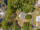 From above, the property is secluded by lush trees, offering serene privacy at 1189 Rib Ave, St Cloud, FL 34771