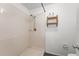 Bathroom features tile shower with shelving at 1189 Rib Ave, St Cloud, FL 34771