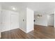 Inviting entryway featuring wood floors and neutral walls, leading into the home's living spaces at 1189 Rib Ave, St Cloud, FL 34771