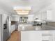 Well-lit kitchen with stainless appliances, ample counter space, and white cabinetry at 1189 Rib Ave, St Cloud, FL 34771
