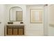 Bright entryway with a decorative mirror, wood console table, baskets, and light neutral decor at 1277 Deepwater Cir, Eagle Lake, FL 33839