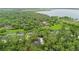 An aerial shot of the neighborhood and a body of water at 1394 Kettledrum Trl, Deltona, FL 32725