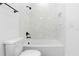 Clean bathroom featuring a shower/tub combination with sleek tiled walls, and modern fixtures at 1394 Kettledrum Trl, Deltona, FL 32725