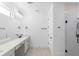 Contemporary bathroom features double vanity, quartz countertop, and glass shower at 1394 Kettledrum Trl, Deltona, FL 32725