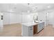 Spacious kitchen with a large center island, stainless sink, and modern finishes at 1394 Kettledrum Trl, Deltona, FL 32725
