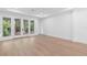 Bright living room featuring wood flooring, recessed lighting, and glass doors to the outdoors at 1394 Kettledrum Trl, Deltona, FL 32725