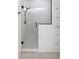 Glass-enclosed shower with a rainfall showerhead and tiled walls at 1394 Kettledrum Trl, Deltona, FL 32725