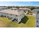 Aerial view of the townhome featuring a small backyard and green space at 1401 Mirabella Cir, Davenport, FL 33897