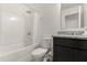 Bathroom featuring a shower over tub, toilet, and granite vanity at 1401 Mirabella Cir, Davenport, FL 33897