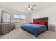 Bright bedroom with a large window, plush carpeting, a king-sized bed, and a dresser at 1401 Mirabella Cir, Davenport, FL 33897