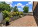 A brick paver patio with lush landscaping and a privacy fence creates a peaceful backyard retreat at 14830 Winkfield Ct, Winter Garden, FL 34787