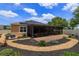 Beautiful backyard with a covered patio, attractive landscaping, and decorative stone at 14830 Winkfield Ct, Winter Garden, FL 34787
