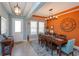 Bright dining room with modern lighting, a large clock, and a spacious dining table with seating for six at 14830 Winkfield Ct, Winter Garden, FL 34787