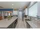 Bright kitchen features a large center island with seating, stainless steel appliances, and ample countertop space at 14830 Winkfield Ct, Winter Garden, FL 34787