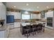 Bright kitchen with an oversized island, modern appliances, white cabinetry, and subway tile backsplash at 14830 Winkfield Ct, Winter Garden, FL 34787