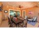Stylish enclosed patio with a dining area, comfortable seating, and outdoor decor at 14830 Winkfield Ct, Winter Garden, FL 34787