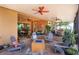 Spacious screened patio with fire pit, seating, dining area, and backyard access at 14830 Winkfield Ct, Winter Garden, FL 34787