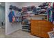 Walk-in closet provides custom shelving and organizational features at 14830 Winkfield Ct, Winter Garden, FL 34787