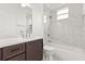 Bathroom featuring a marble tile backsplash, dark cabinets and shower with tub at 14927 Faversham Cir, Orlando, FL 32826