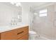 Bathroom showcasing a stylish vanity and a glass-enclosed shower with tile surround at 14927 Faversham Cir, Orlando, FL 32826