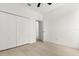 Bright bedroom featuring a closet, ceiling fan, and light wood flooring at 14927 Faversham Cir, Orlando, FL 32826