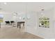 Upstairs living area with a foosball table, modern lighting, and views of the neighborhood, spacious design at 14927 Faversham Cir, Orlando, FL 32826