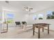 Bright game room featuring a foosball table, cozy seating, and large windows offering ample natural light at 14927 Faversham Cir, Orlando, FL 32826