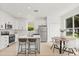 Well-lit kitchen boasts stainless steel appliances and a breakfast bar at 14927 Faversham Cir, Orlando, FL 32826