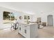 Bright open-concept living room with modern decor, including dining area and living space with big windows at 14927 Faversham Cir, Orlando, FL 32826