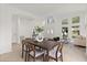 Bright, open-concept living and dining space with tall windows at 14927 Faversham Cir, Orlando, FL 32826