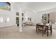 Spacious living room with high ceilings, large windows, and natural light, perfect for relaxing or entertaining at 14927 Faversham Cir, Orlando, FL 32826