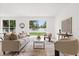 Inviting living room with a view of the backyard at 14927 Faversham Cir, Orlando, FL 32826