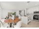 Spacious open-concept living and kitchen area with modern finishes and plenty of natural light, and staircase at 14927 Faversham Cir, Orlando, FL 32826