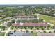 An aerial view showcasing townhomes with well-manicured landscaping in a serene community at 152 Riggings Way, Clermont, FL 34711