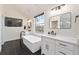 Bright bathroom featuring a tub, double vanity, and outside view at 152 Riggings Way, Clermont, FL 34711