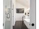 Modern bathroom featuring black tile floor, stand alone tub and glass shower at 152 Riggings Way, Clermont, FL 34711