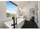 Bright bathroom featuring a stand alone tub, shower and bed view at 152 Riggings Way, Clermont, FL 34711