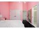 Cozy pink bedroom with closet, adjacent bathroom, and modern finishes at 152 Riggings Way, Clermont, FL 34711