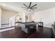 Spacious living room with hardwood floors, recessed lighting, a ceiling fan, and a stylish pool table at 152 Riggings Way, Clermont, FL 34711