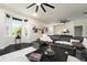 Bright living room with large windows, stylish furniture, and modern decorations at 152 Riggings Way, Clermont, FL 34711