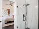 A luxurious glass shower showcases the elegant bathroom connected to the bedroom at 152 Riggings Way, Clermont, FL 34711